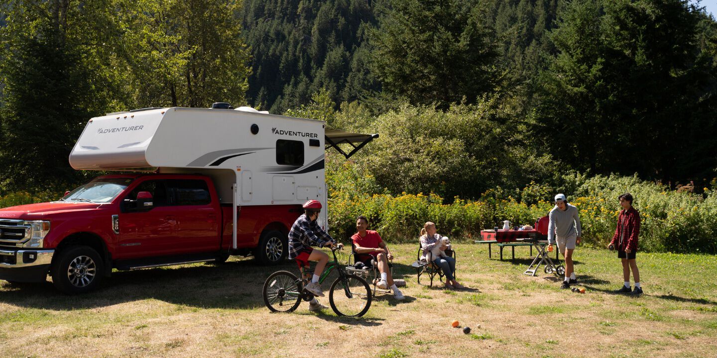 Family Enjoying Camping with Truck Camper on a Long Weekend in Canada